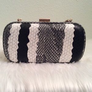 Black and white evening bag in a snakeskin pattern